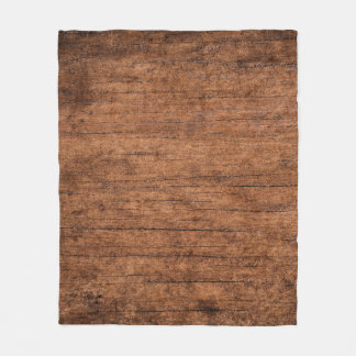 Gammal mörk texturerad träbakgrund, su fleecefilt