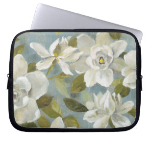 Gardenias kritiserar på blått laptop sleeve