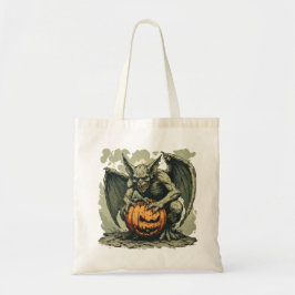 Gargoyle och en Halloween-pumpa på en Tygkasse