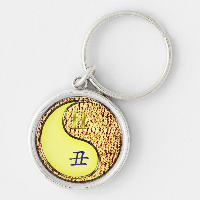 Gemini & Fire Ox Rund Silverfärgad Nyckelring (Framsidan)