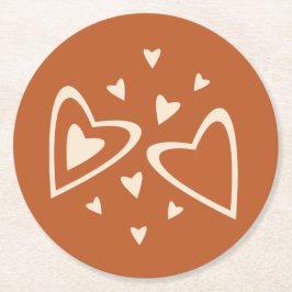 Geometri i kärlek - grädde på röd ockra - bild.   underlägg papper rund