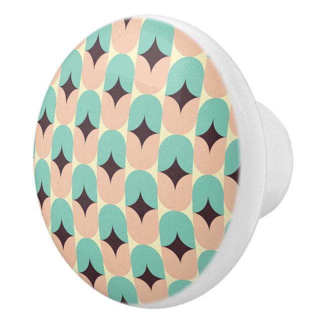 Geometric pattern of teal, beige, and black shapes knopp (Höger)