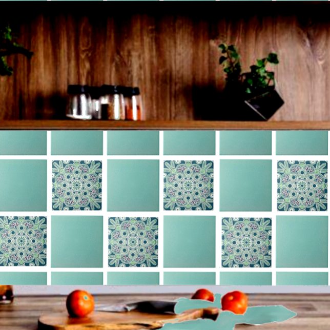 Geometrisk keramisk platta med lätta gröntar och t kakelplatta (Green geometric tile shown on a kitchen backsplash with  green field tiles.)