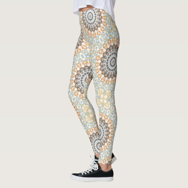 Geometrisk mandala i orange, grått och blått leggings (Vänster)
