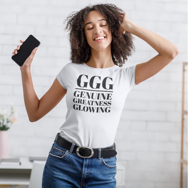 GG- Äkta, storhet, glödande T Shirt (Young woman dances in "GGG: Genuine, Greatness, Glowing" white t-shirt.)