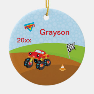 Gigantisk lastbilsmuts spårar den röda julgransprydnad keramik