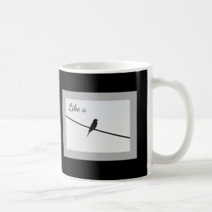 Gilla en fågel på en binda kaffemugg