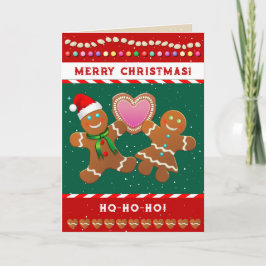 Gingerbröd kookies som håller ett hjärta helgkort