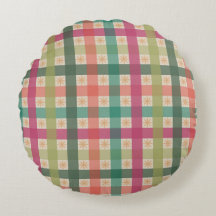 Gingham och geometriskt blommönster runt kuddfall