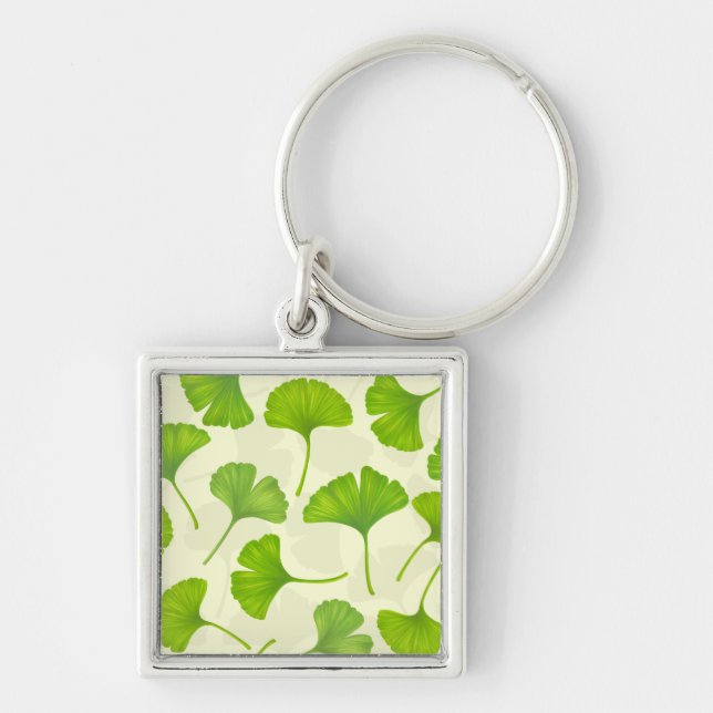 Ginkgo mönster på benvit fyrkantig silverfärgad nyckelring (Framsidan)