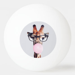 Giraffe wearing glasses blowing a pink bubble gum pingisboll