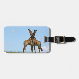 Giraffet kopplar samman bagagemärkren bagagebricka
