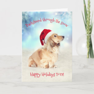 Glad helg!Kort Dachshund genom snö Helgkort
