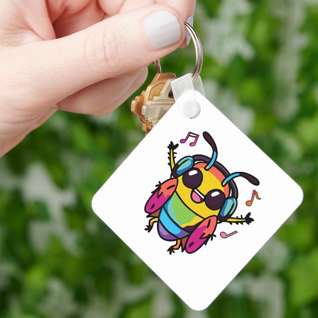 Glad kackerlacka med hörlurar som lyssnar på musik nyckelring (Happy cockroach with headphones listening to music. keychain)