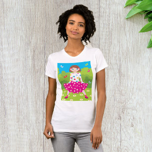 Glad liten flicka med blommor och fjärilar t shirt