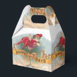 Glad viktoriansk kvinna i röd champagne presentaskar<br><div class="desc">Viktoriansk kvinna i rött firar med champagneglas - "Glada dagar" utropas med all önsklig tydlighet i denna roliga vintage annons för cigarrer. Den lilla kvinnan hamnade på något sätt sittande inne i ett ganska stort champagneglas med sin drink. Annonsen publicerades 1909 och är verkligen en vacker bild för din present....</div>