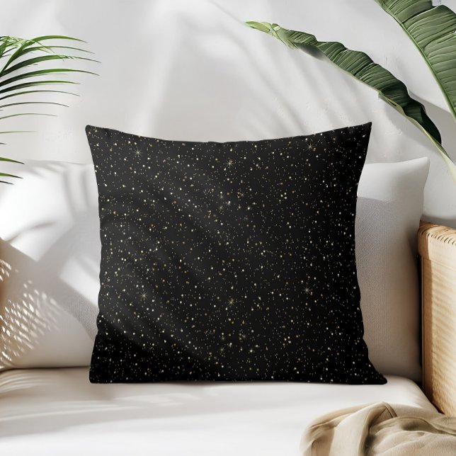 Glam guld glitter och gnistbilder på svart kudde (Skapare uppladdad)