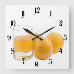 Glas av saften och de tre orangarna fyrkantig klocka