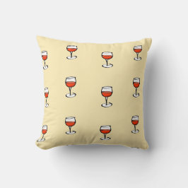 Glas från vin på orange kudde