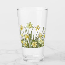 Glas med blommigt gräns av gult daffodils