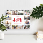 Glatt år | Fotokalender Kalender<br><div class="desc">ett favoritminne på varje sida i fotokalendern. Försättsbladet innehåller en miniatyrversion av varje foto med "ett års glädje" i mitten med festive red lettering. En röd snöflinga tar ställe från "O" för extra helgdag cheer. Anpassa skyddet med ditt namn eller med din familj namn och året.</div>
