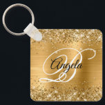 Glittery Gold Foil Finare Monogram Nyckelring<br><div class="desc">Elegant guld glitter med gnistor mot en motsvarande bild av metall med faux-borstad folie. Det går att anpassa kalligrafimonogrammet för svart och vitt finare i mitten. All sparsam och glansig inslag i denna moderna gigantiska design är digital grafik. Monogrammed värdefull nyckelring party favors för hennes speciella födelsedag.</div>