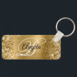 Glittery Gold Foil Finare Monogram Nyckelring<br><div class="desc">Elegant guld glitter med gnistor mot en motsvarande bild av metall med faux-borstad folie. Det går att anpassa kalligrafimonogrammet för svart och vitt finare i mitten. All sparsam och glansig inslag i denna moderna gigantiska design är digital grafik. Monogrammed värdefull nyckelring party favors för hennes speciella födelsedag. En trevlig storlek...</div>