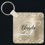 Glittery Light Gold Foil Finare Monogram Nyckelring<br><div class="desc">Elegant blek champagne guld glitter med gnistor mot ett pluttigt plåtbildsmönster från metall. Det går att anpassa kalligrafimonogrammet för svart och vitt finare i mitten. All sparsam och glansig inslag i denna moderna gigantiska design är digital grafik. Monogrammed värdefull nyckelring party favors för hennes speciella födelsedag.</div>