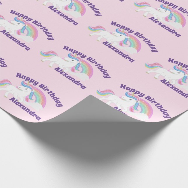 Glittrande regnbåge enhörning födelsedag på rosa presentpapper (Hörn)
