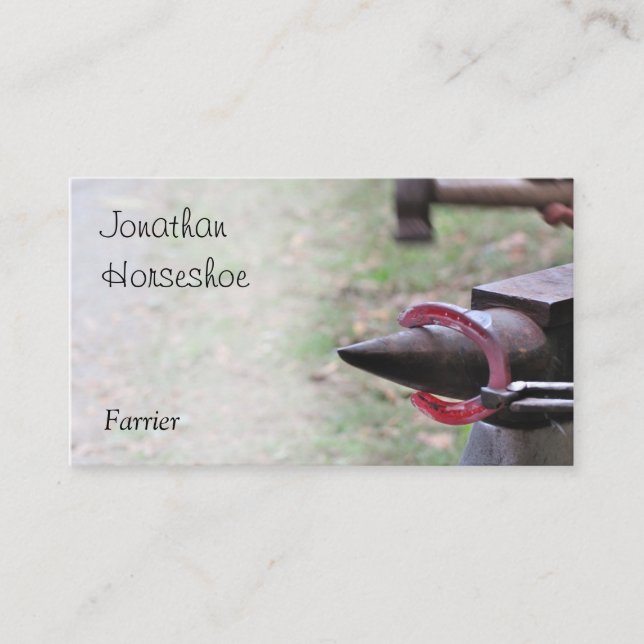 Glödhet hästsko på ett städ visitkort (Framsida)