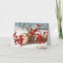 Gnomes dragging a cut tree trunk through the snow kort