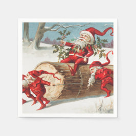 Gnomes dragging a cut tree trunk through the snow pappersservett