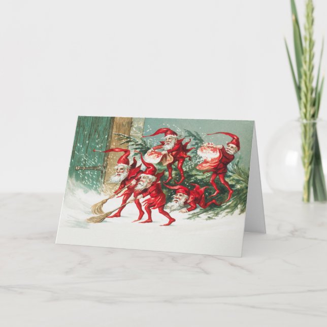 Gnomes sweeping snow with a broom kort (Framsida)