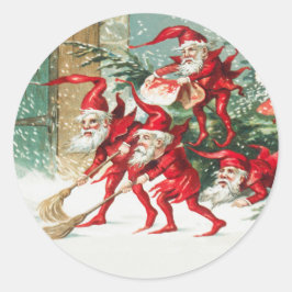 Gnomes sweeping snow with a broom runt klistermärke