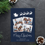 God jul 4 Photo Santa Sleigh Blue Julkort<br><div class="desc">Festivt blått helgdag med 4 fotokollage av bilder utspridd i vitt ramar,  en silhuett av renar som flyger tomtens sleigh,  "God jul" i ett snyggt vitt skript och ditt namn i vanlig vit typografi.</div>