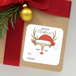 God jul Cute Personlig Reindeer Fyrkantigt Klistermärke<br><div class="desc">En söt renar ansikte med en jultomtehatt dekorerar detta kvadratiska klistermärke med ord God jul och till: och från: Roligt för att dekorera julklappar och helgdag för att behandla påsar för grannar. Anpassa det med ditt namn. Designad av Blackberry Boulevard.</div>