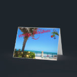 God jul från Vero Beach Florida Oceanfront Helgkort<br><div class="desc">God jul från Vero Beach, Florida! Det här färgstarka, tropiska hälsningskortet har en fotobild av ett vackert Vero Beach oceanfront-område som alla är dekterade för helgdagarna. I festiteriet ingår ljus på grejen, julen bollar som hänger från en handflatan-frond, och texten "God jul" i rött skript som står i perfekt kontrast...</div>
