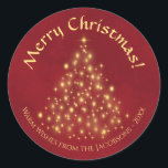 God jul! Golden Ljus Träd på Crimson Red Runt Klistermärke<br><div class="desc">De vackra julklistermärkena har en vacker design som är i gång traditionell och modern form. Det finns ett Julgran som är helt och hållet av guld ljus på en marmorerad, skriven röd bakgrund. Bildtexten läser God jul och det finns utrymme nedan för en kort-anteckning eller namnteckning. Perfekt som kuvertförseglingar eller...</div>