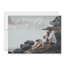 God Jul i skrivstil på helbildsfoto