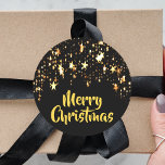 God jul på svart med lysande stjärnor runt klistermärke<br><div class="desc">En svart bakgrund med en kaskad av gyllene skuggstjärnor,  lite av lek och lyx till jul. Golden brev och texten: God jul!</div>