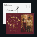 Gold Leaves Burgundy Wedding Save the Date Photo Meddelande Vykort<br><div class="desc">This wedding Save the Date postcard is rustic, elegant, and beautiful. It features a hand painted watercolor design with sprigs of golden laurel leaves or vines and modern script lettering on a marbled burgundy background. There is space for your photo, the couple's name, and the wedding location. The back has...</div>