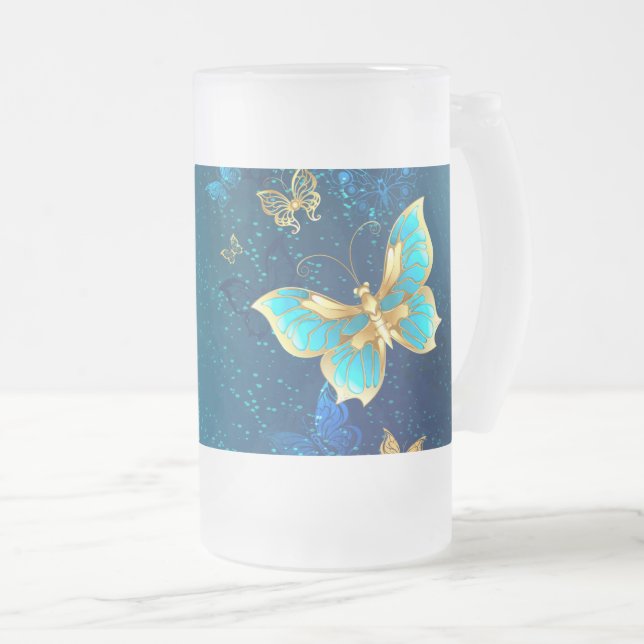 Golden Butterflies på en blå bakgrund Frostat Ölglas (Framsida höger)