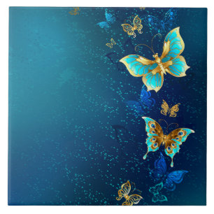 Golden Butterflies på en blå bakgrund Kakelplatta