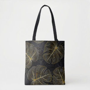 Golden monstera löv, romantisk sömlös blommigt. tygkasse