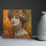 Golden Phase Gustav Klimt Mosaic Edwardian Woman C Kakelplatta<br><div class="desc">Den här vackra keramiska plattan har en grafik som inspirerats av Gustav Klimts "gyllene fas", som skildrar en kvinna från Edwardian-eran. Under denna period fascinerades Klimt av bysantinska mosaiker och utvecklade sin mosaikteknik med hjälp av guld löv och vibrant färg. Denna teckning betalar ett erkännande för Klimts innovativa mosaikstrategi och...</div>