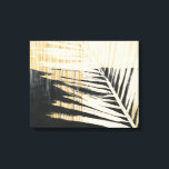 Golden Raffia - Handflatan Fronds Canvastryck<br><div class="desc">Golden Raffia II av Jennifer Paxton Parker. Har en enda löv-silhuett från handflatan i svart och gult/tan färg.</div>