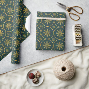 Golden Snowflake-julklapp som täcker pappra Presentpapper