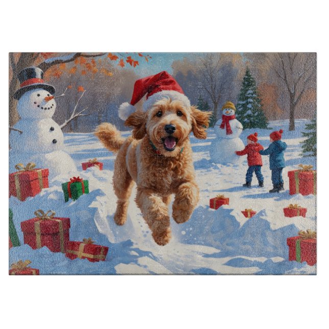 Goldendoodle springer i snö med julhatt (Framsidan)