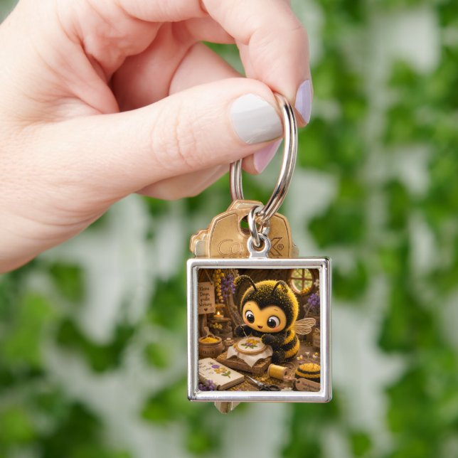 Goldene Hummel im Blütentanz.11 Fyrkantig Silverfärgad Nyckelring (Hand)
