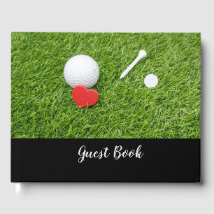 Golf boll med gnutta och rött hjärta på grönt bröl gästböcker